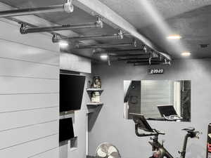 Workout area with a textured ceiling