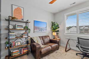 Office space featuring wood finished floors and a ceiling fan
