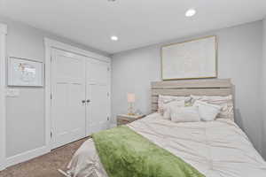 Bedroom with carpet, a closet, and recessed lighting