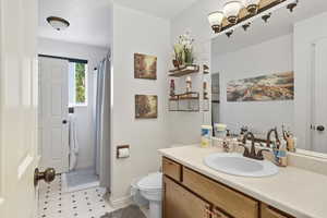 Full bathroom featuring 2 sink vanity and tub/shower combo