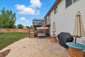 View of patio featuring stairs and deck