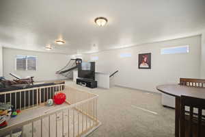 Playroom with carpet flooring and baseboards
