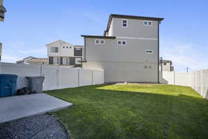 Fenced backyard featuring a patio
