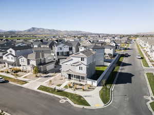Aerial perspective of suburban area featuring a mountain backdrop