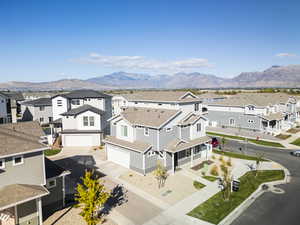 Aerial perspective of suburban area featuring a mountainous background