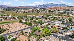 Aerial view of residential area with a mountain view & nearby golf course