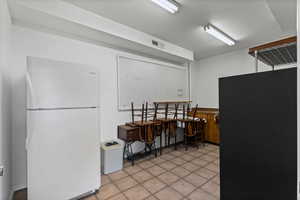 Storage room off garage with sink