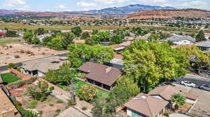 Aerial perspective of suburban area with a mountain backdrop