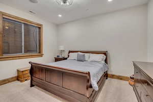 Bedroom featuring recessed lighting and light colored carpet