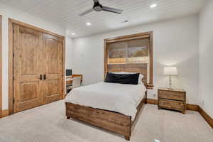 Bedroom featuring carpet, recessed lighting, a ceiling fan, a desk, and a closet