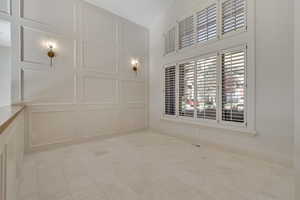 Empty room with a decorative wall and baseboards