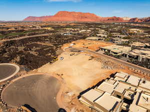 Aerial view of residential area with a mountainous background and a desert landscape