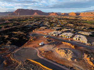 Aerial view of property's location featuring mountains and nearby suburban area