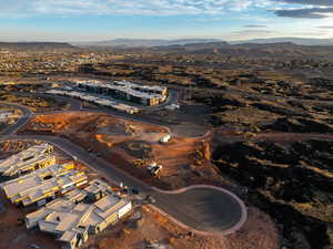 Aerial view of property and surrounding area featuring mountains