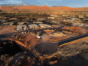 Aerial view of property's location with a mountain backdrop
