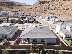 Aerial perspective of suburban area with a mountain backdrop