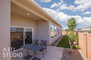 Fenced backyard with a patio area