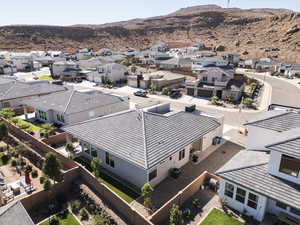 Aerial perspective of suburban area with a mountainous background