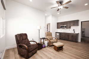Sitting room with recessed lighting, light wood finished floors, and ceiling fan