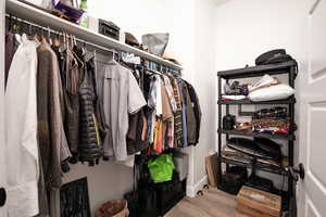 Walk in closet featuring light wood-style flooring