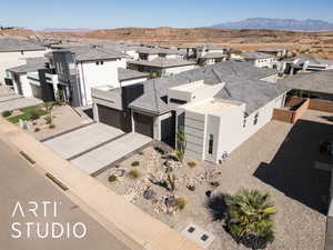 Aerial perspective of suburban area with a mountainous background