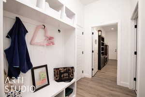 Mudroom featuring light wood-style flooring