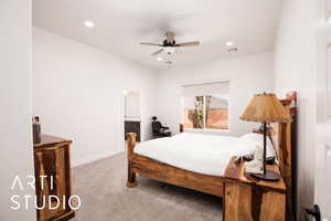 Bedroom featuring light colored carpet, ceiling fan, recessed lighting, and connected bathroom