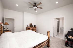 Bedroom featuring recessed lighting, light carpet, ceiling fan, and light marble finish flooring