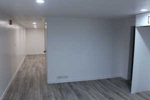 Finished basement with recessed lighting and wood finished floors