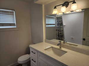 Bathroom featuring vanity and a shower with curtain