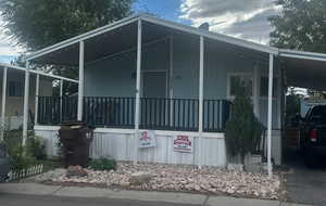 View of side of home with a carport