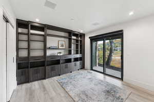 Unfurnished living room featuring light wood-type flooring and recessed lighting