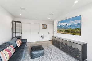 Living room featuring wood finished floors and recessed lighting