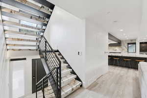 Staircase with wood finished floors