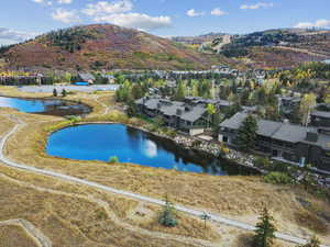 Aerial view of residential area featuring a water and mountain view