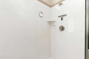 Bathroom view of a marble finish shower