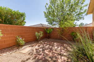 Fenced backyard with a patio area
