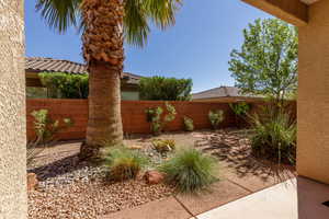 Fenced backyard with a patio area