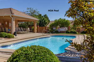Community pool featuring a patio