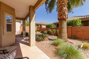 Fenced backyard featuring a patio
