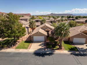 Aerial perspective of suburban area featuring a mountain backdrop