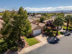 Aerial perspective of suburban area with a mountainous background