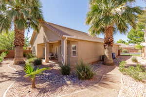 View of home's exterior with a fenced backyard, stucco siding, and a tiled roof