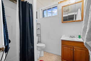 Bathroom with vanity and a shower with curtain