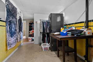 Bathroom featuring dark speckled floor