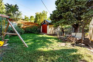 Fenced backyard with a shed
