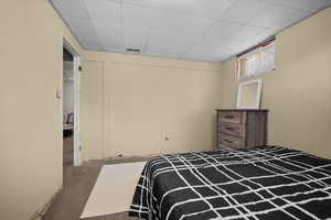 Bedroom featuring a drop ceiling