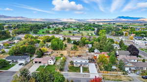 Aerial view of residential area featuring mountains