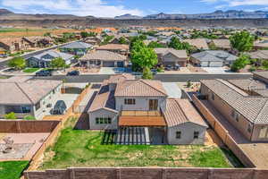 Aerial perspective of suburban area with a mountain backdrop