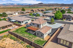 Aerial perspective of suburban area featuring a mountain backdrop